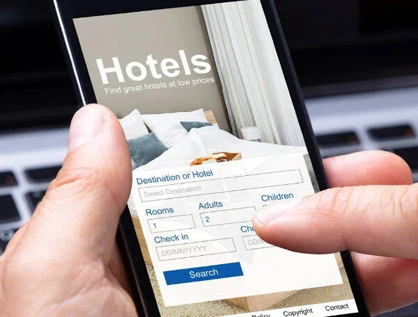 Hotel website showing “Book Now” button with exclusive offers, illustrating incentives for direct booking.