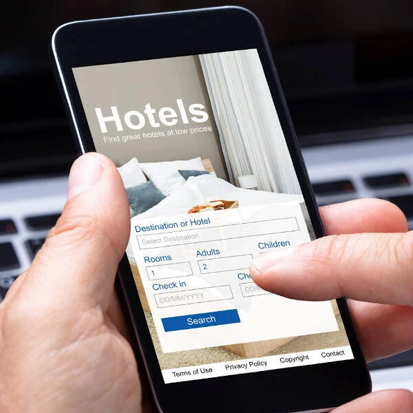 Hotel website showing “Book Now” button with exclusive offers, illustrating incentives for direct booking.