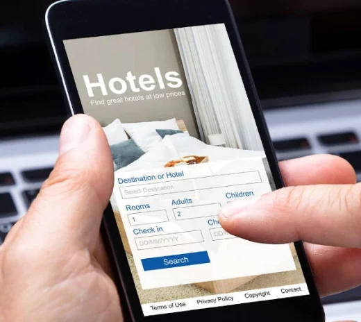 Hotel website showing “Book Now” button with exclusive offers, illustrating incentives for direct booking.
