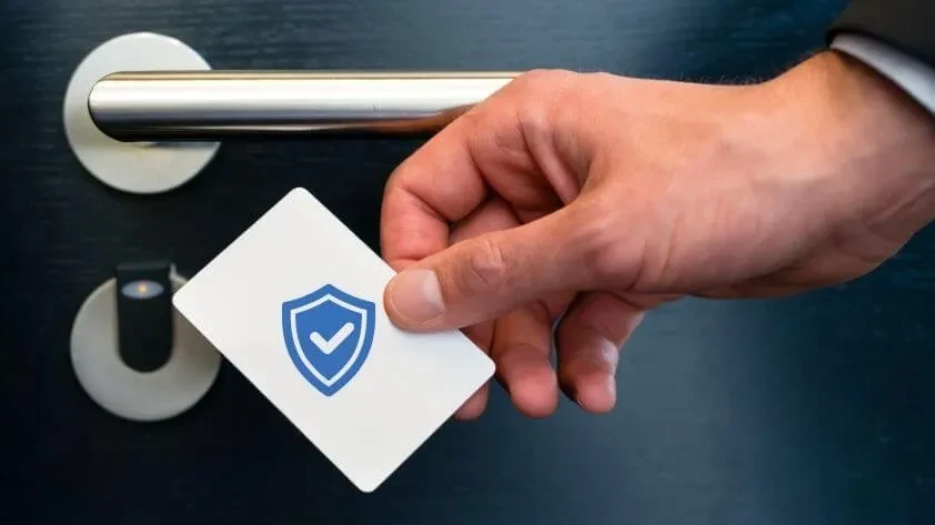 Close-up of a branded room access card placed on a hotel bedside table, representing a stylish Hotel Key Card.