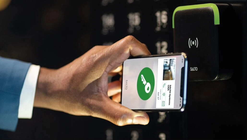 Modern RFID card unlocking a hotel room door, showcasing the convenience of a Hotel Key Card system.